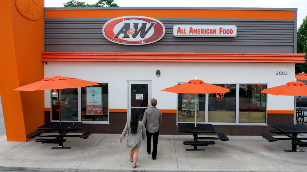 A&W website exterior with people walking in A&W restaurant franchise